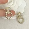 CHAN 23 Full diamond Hollowed-out heart-shaped double c stud earrings