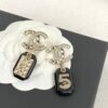 CHAN 23 Black resin 5-shaped bag ear studs
