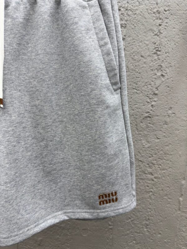 MIUMIU embroidered and labeled fringed shorts