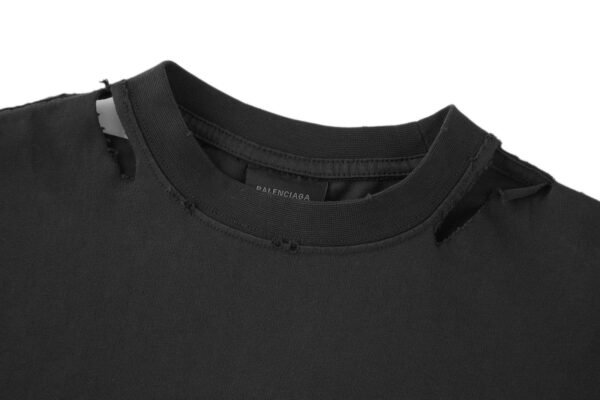 7-7-6.jpg Balenciaga’s vision chart print cuts through the short sleeve