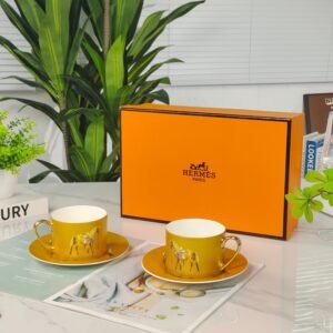 Hermès Gold Coffee Cup and Saucer Set