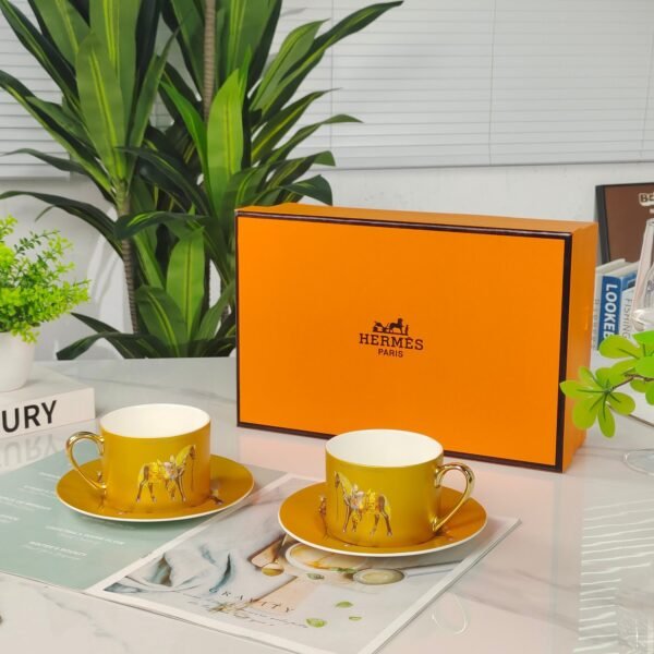 Hermès Gold Coffee Cup and Saucer Set
