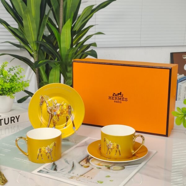 Hermès Gold Coffee Cup and Saucer Set
