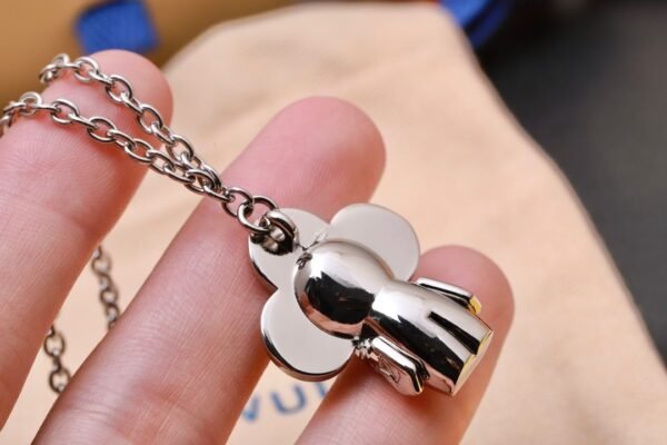 Louis Vuitton Vivienne pendant in polished metal with LV lettering