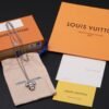 Louis Vuitton Vivienne pendant in polished metal with LV lettering