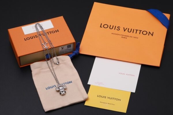 Louis Vuitton Vivienne pendant in polished metal with LV lettering