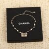 Chanel Black lace bag necklace