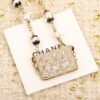 Chanel Black lace bag necklace