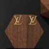 Louis Vuitton gold letter earrings