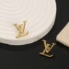 Louis Vuitton gold letter earrings