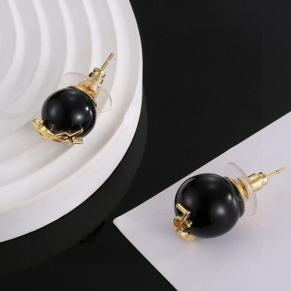 YSL pearl earrings  Inlaid with YSL logo, two large and one small