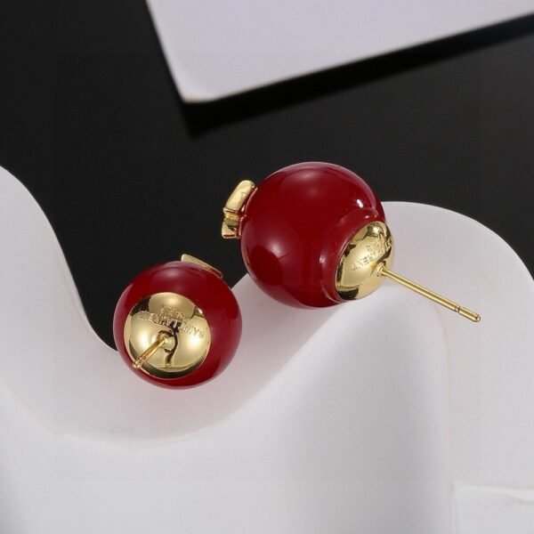 YSL pearl earrings  Inlaid with YSL logo, two large and one small