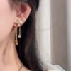 Louis Vuitton diamond floral tassel letter earrings