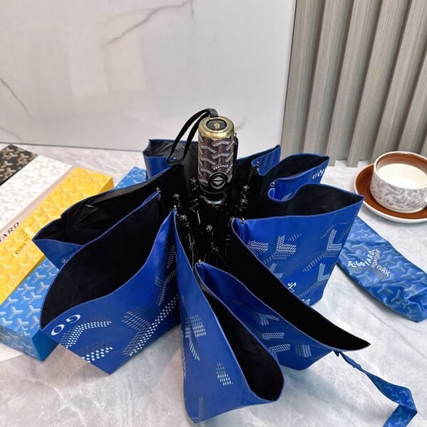 Goyard tri-fold sun-protective umbrella has a black inner coating that effectively blocks 99% of UV rays.