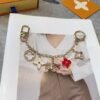 Louis Vuitton keychain bag pendant One of the hallmarks of the Fleur de Monogram bag