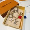 Louis Vuitton keychain bag pendant One of the hallmarks of the Fleur de Monogram bag