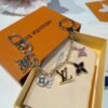 Louis Vuitton keychain bag pendant One of the hallmarks of the Fleur de Monogram bag