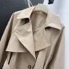 Loewe’s new autumn and winter lapel bud trench coat mid-length design