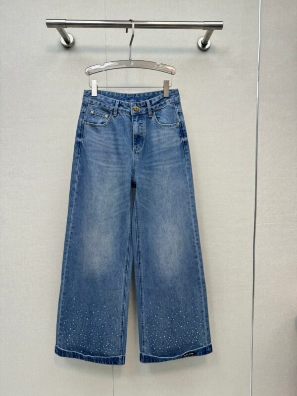 Miu Miu style jeans with rhinestone embellishments on the cuffs, made with high-quality fabric and a special washing process.