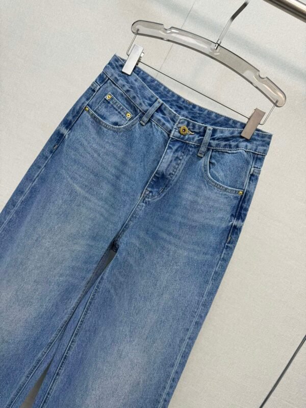 Miu Miu style jeans with rhinestone embellishments on the cuffs, made with high-quality fabric and a special washing process.