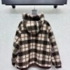 Miu Miu plaid reversible denim jacket with shearling lining – a winter essential.
