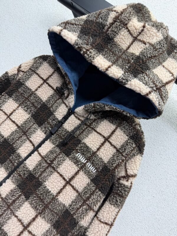 Miu Miu plaid reversible denim jacket with shearling lining – a winter essential.