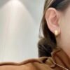 LV four-leaf clover hollowed-out twisted earrings