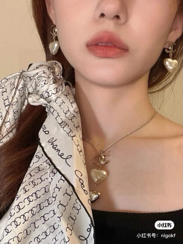 Chanel light gold heart heart earrings