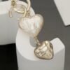 Chanel light gold heart heart earrings