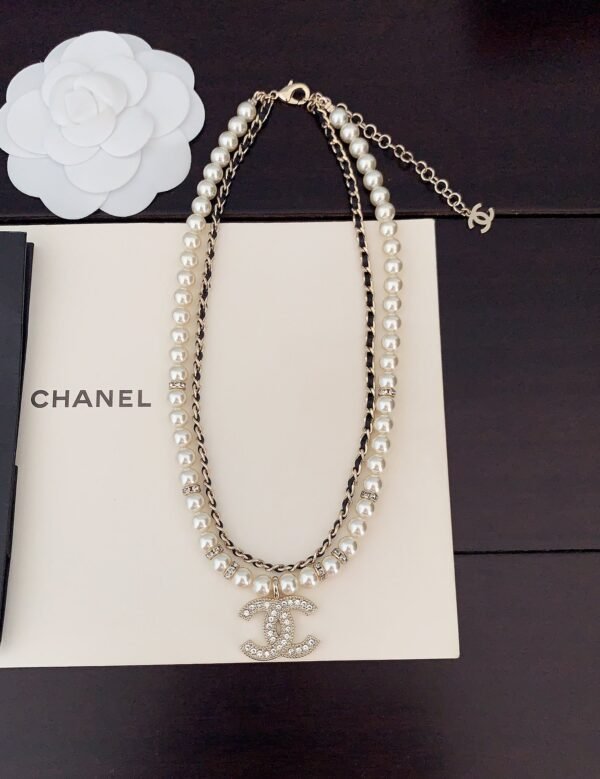 Chanel black leather pearl double necklace