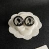 Chanel round figure with double C stud earrings