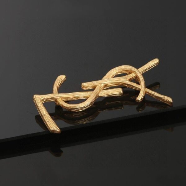 YSL brooch